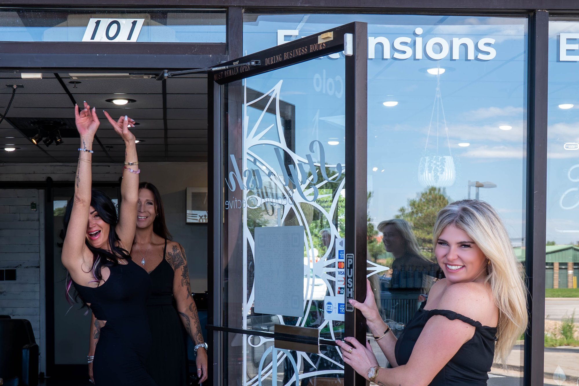 The Styl·ish team welcoming clients at the salon door